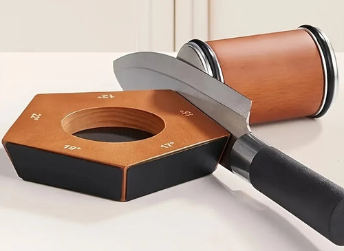 Knife resting on the Whetwood five-angle magnetic base with the rolling sharpener against the edge